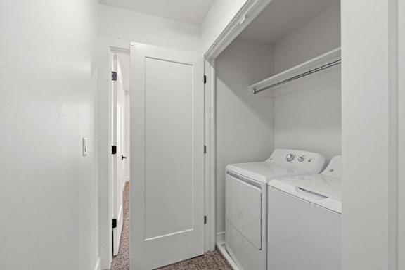 a laundry room with a washer and dryer