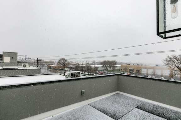 a balcony with a view of the city