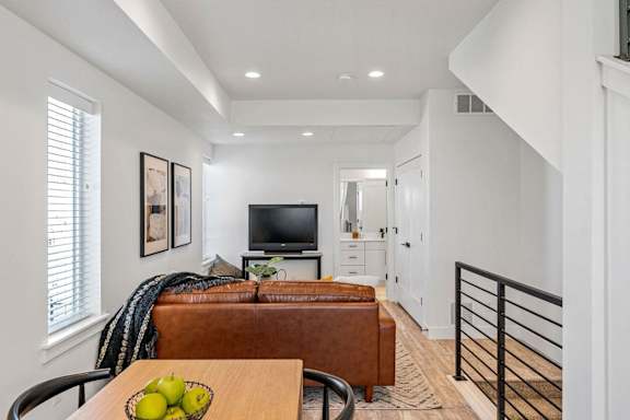 a living room with a couch and a tv
