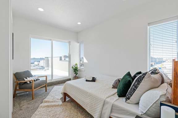 bedroom with a bed and windows