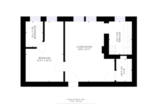A floor plan of a house with a living room, kitchen, and two bedrooms.