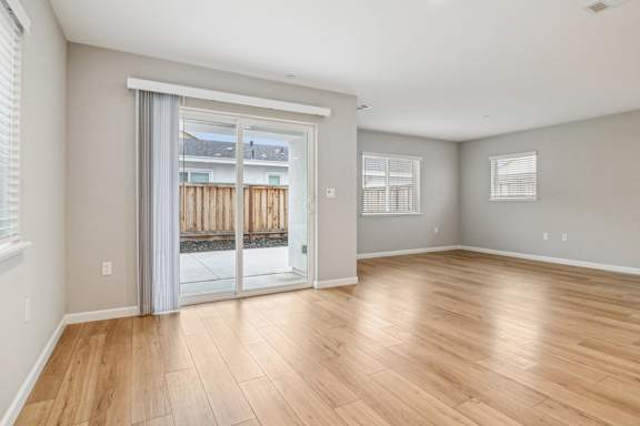 Dinning area with sliding glass door leading outside.