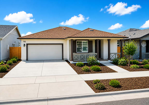 A house with a brown roof and a white garage door.