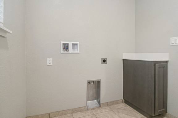Laundry room with washer and dryer hookups
