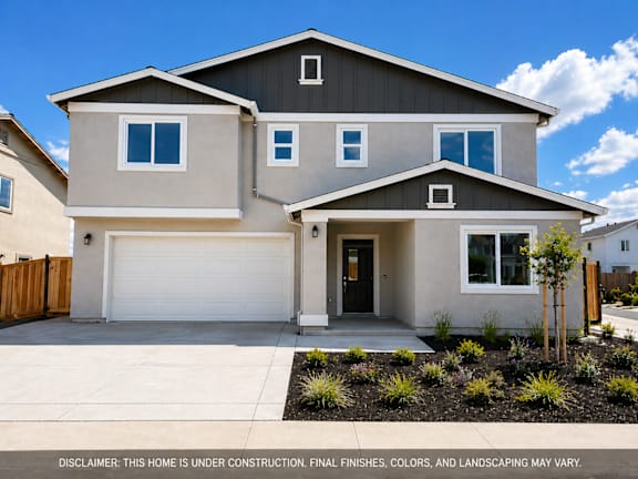 A house under construction with a disclaimer that final finishes, colors, and landscaping may vary.