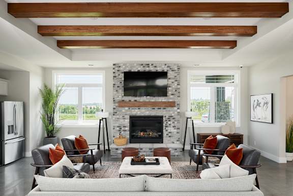 A modern living room with a fireplace and a large couch.