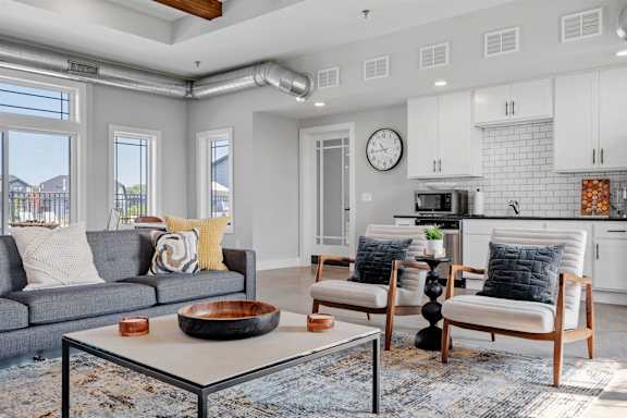 a living room with two couches and a table