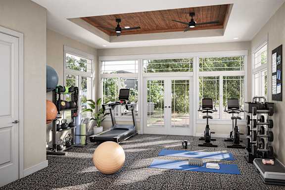 a home gym with exercise equipment and windows