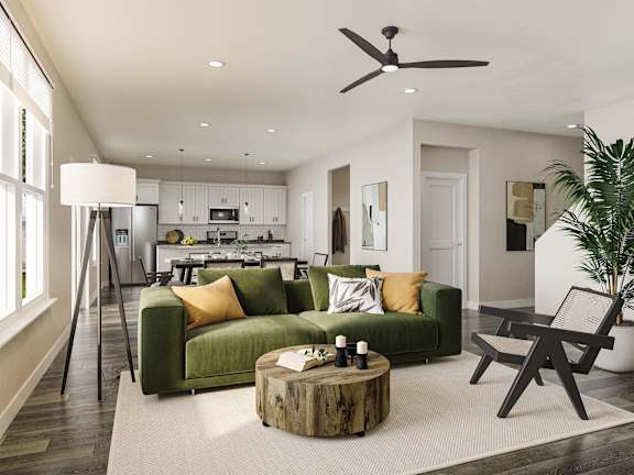 a living room with a green couch and a coffee table