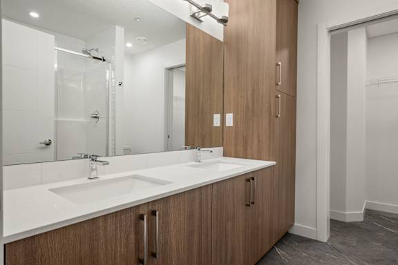 A modern bathroom with a double sink vanity.