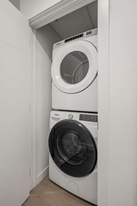 A white washing machine and dryer in a small laundry room.