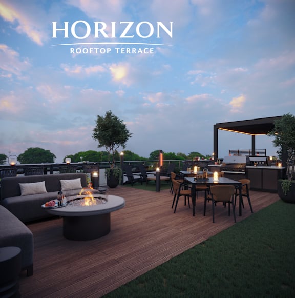 A rooftop terrace with a fire pit and seating area.