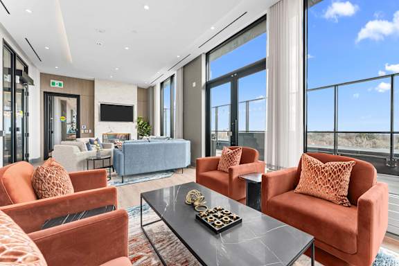 A living room with a chess board on the coffee table.