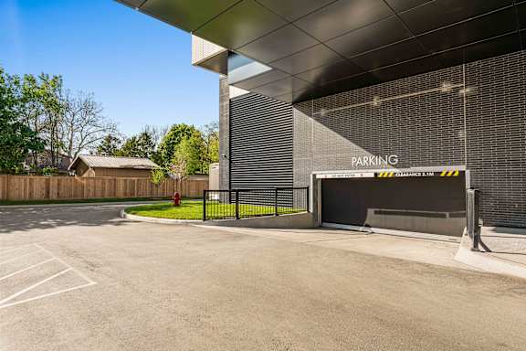 A parking area with a sign that says "PARKING" on the wall.
