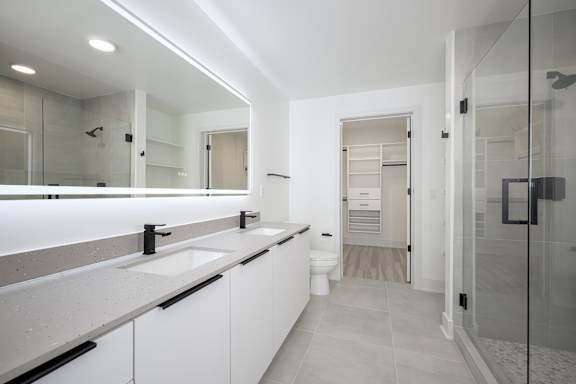 Dual bathroom vanities with quartz countertops