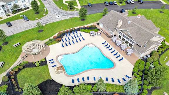 Heated outdoor pool with cascading waterfall and gazebo