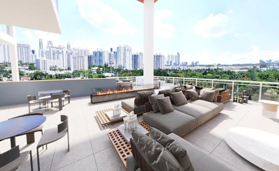 A modern outdoor living space with a view of the city skyline.