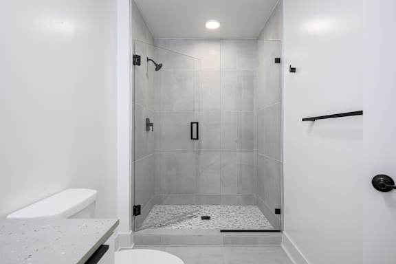 Full-height bathroom wall tile in bath/shower