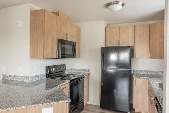 Kitchen with cabinets at St Helens Place Apartment Homes, St Helens, 97051