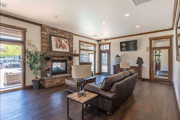 Living Room with stone fireplace at Stoneplace Apartment Homes, Oregon, 97038