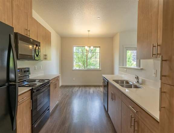 Kitchen with wooden cabinets at Sandyplace Apartment Homes, Sandy, 97055