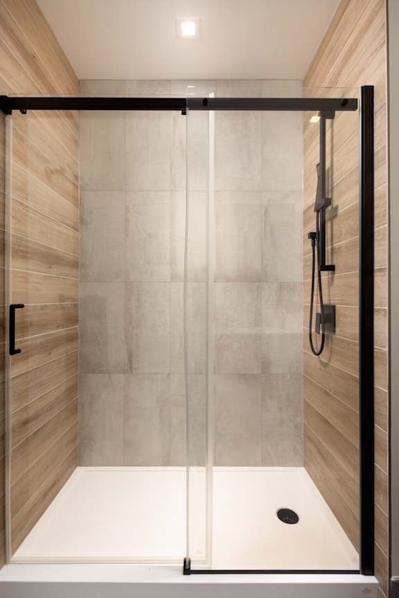 A modern bathroom with a walk-in shower at Damask, Windsor