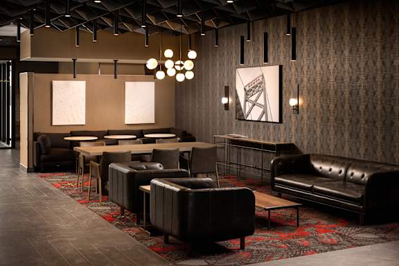 Lobby lounge featuring modern seating and abstract carpet at Damask, Ontario