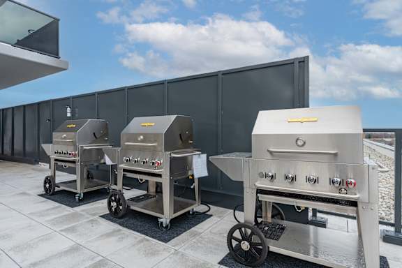 Three industrial ovens are lined up on a patio at Damask, Windsor, N8S 0B7