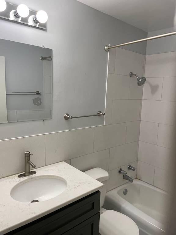 A white sink is in a black and white bathroom.