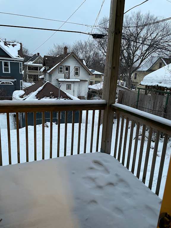 A snowy scene from a balcony.