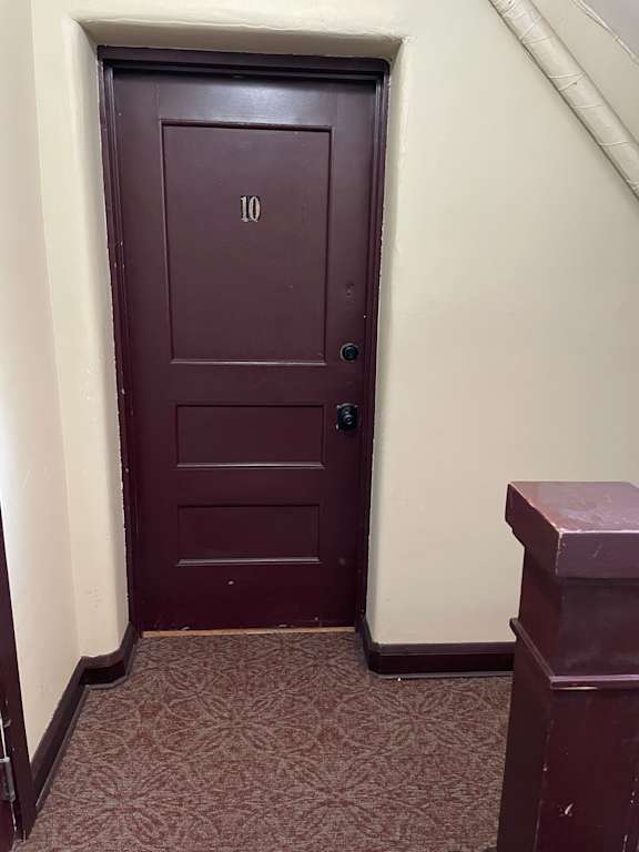 A brown door with the number 10 on it.