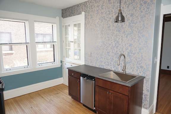 A kitchen with a dishwasher and sink.