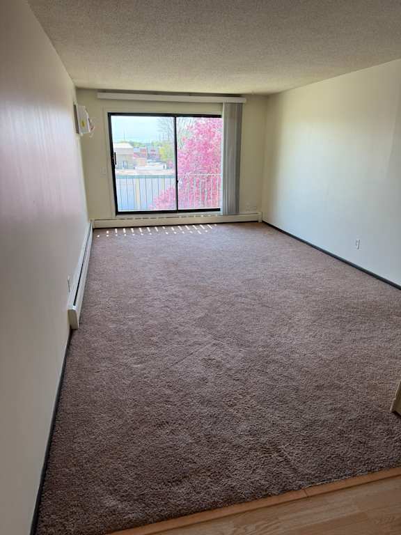 A room with a window and a brown wall.