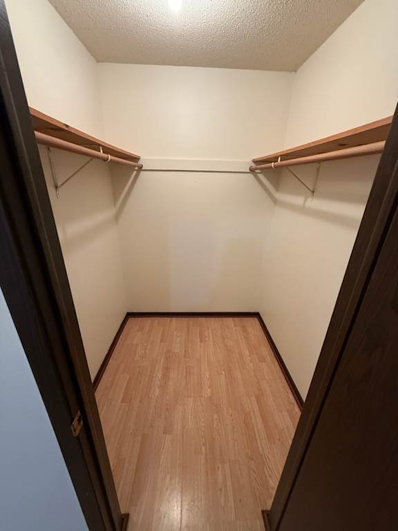 A wooden floor is visible from an elevated viewpoint.