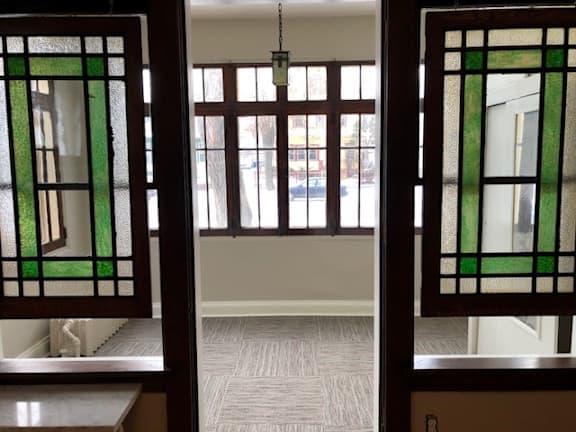 A view through a window with a green frame.