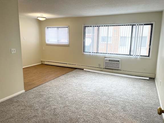 A room with a window and a door.