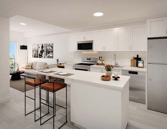 A modern kitchen with white cabinets and a large island.