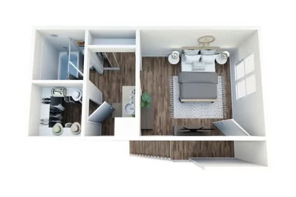 A white room with a grey couch and a small table.