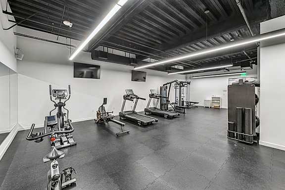 Gym with variety of fitness equipments at 701 Hudson, Los Angeles
