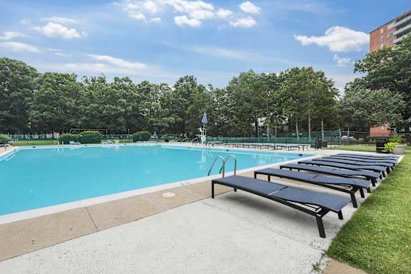 Outdoor swimming pool with sun lounger at The Graham at Southern Towers, Alexandria, Virginia