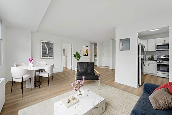 A modern living room with a dining table and chairs.at Sherwood at Southern Towers, Virginia
