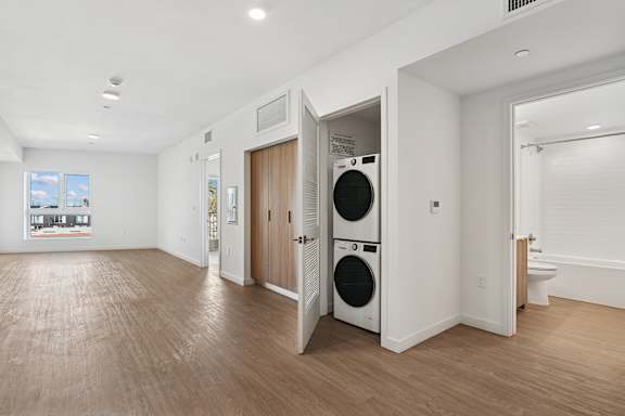 A laundry room with a washer and dryer in it.