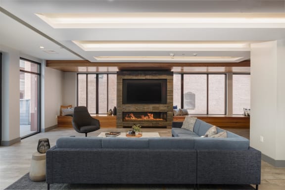 Resident club lounge with cozy fireplace in Providence, RI
