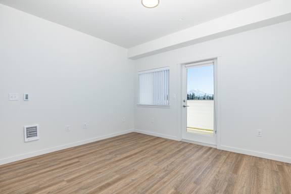 A room with a window and a door.