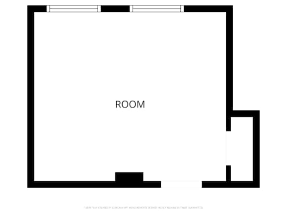 A black and white floor plan of a room with a section cut out.