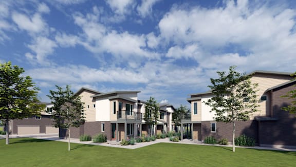 A modern house with a well-manicured lawn in front.
