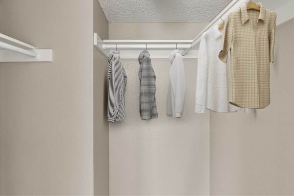 Clothes hanging on a clothes rack.