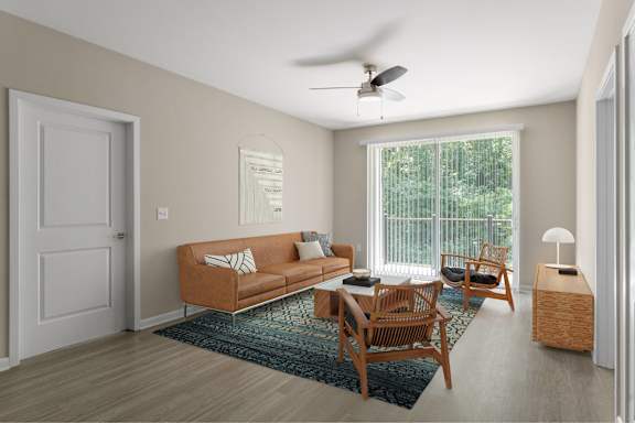 A living room with a brown sofa, a wooden table, and a ceiling fan.