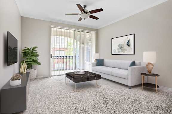 A living room with a white couch, a grey cabinet, a coffee table, a ceiling fan, and a painting on the wall.