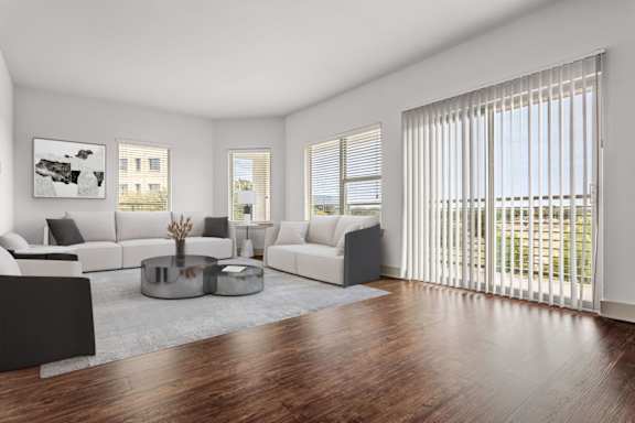 A modern living room with a large window and a view of the outside.